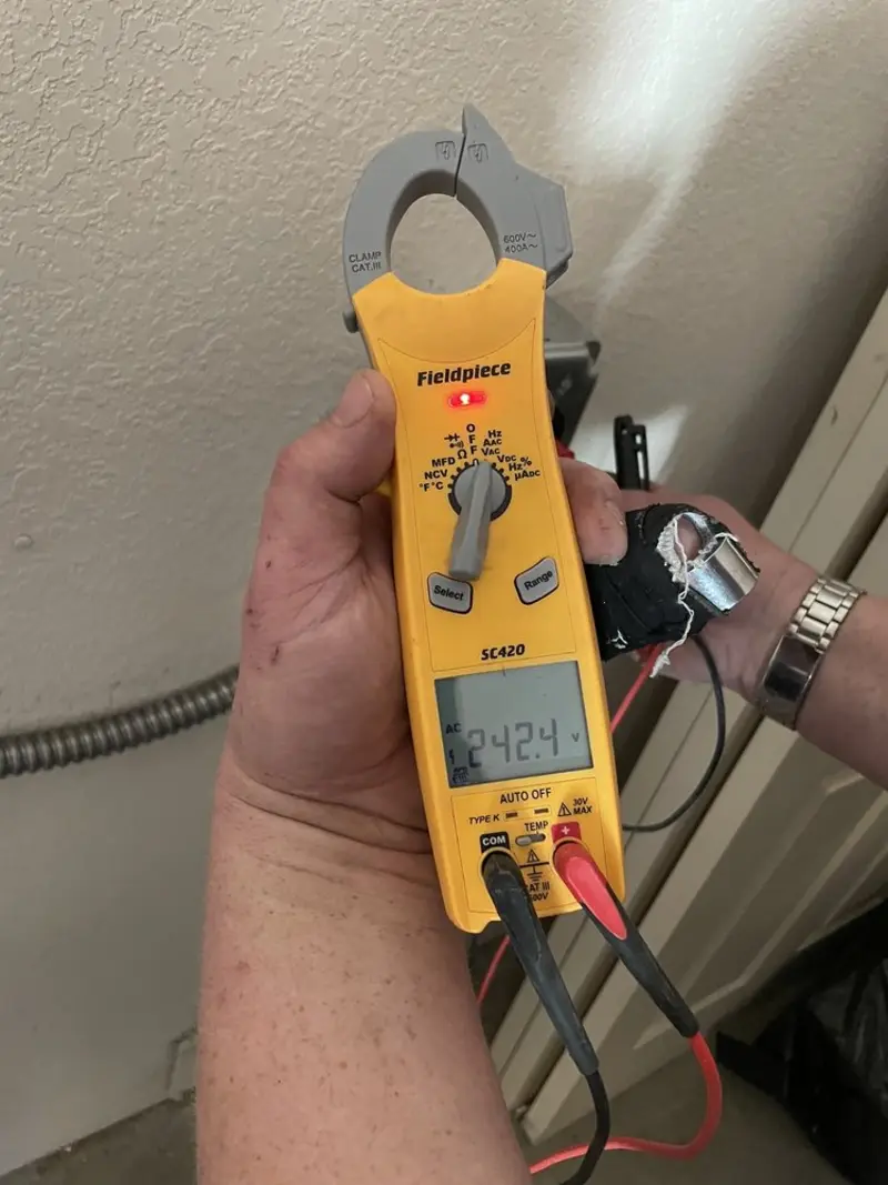 Voltage testing with clamp meter during Electrical Installation Services in Oshkosh